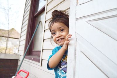 Portrait of smiling girl playing