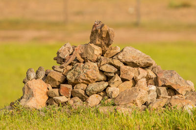 Stack of rocks on field