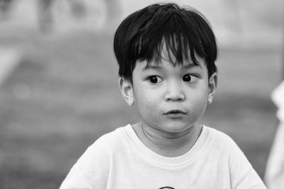 Black and white head shot of 3 years old asian little boy