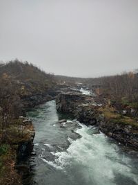 Scenic view of river against clear sky