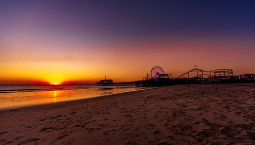 View of amusement park at sunset