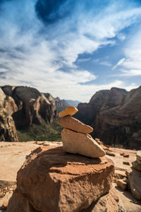 Stack of stones against rocky landscape