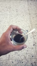 Close-up of hand holding drink