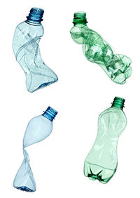 Digital composite image of water and bottle against white background