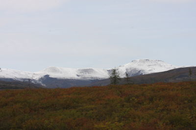 Scenic view of snowcapped mountains against sky