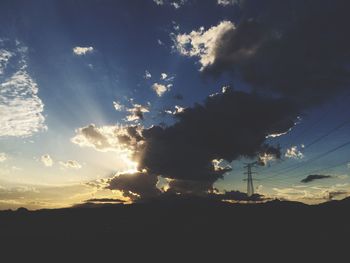 Low angle view of silhouette trees against sky at sunset