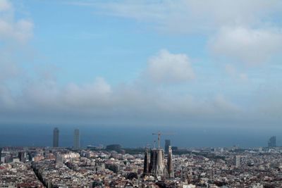 High angle view of buildings in city against sky