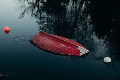 Abandoned boat floating on water