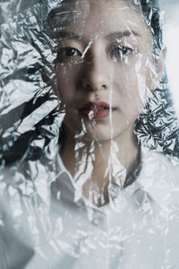 Close-up portrait of woman in snow