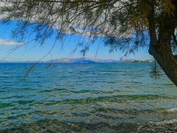 Scenic view of sea against blue sky