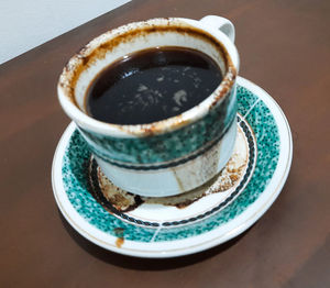 High angle view of coffee cup on table