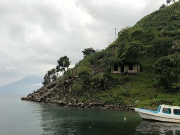 Scenic view of sea and buildings against sky