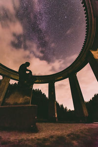 Low angle view of old building against sky at night