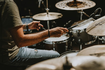 Man playing drums at music concert