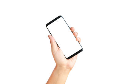 Midsection of person using smart phone against white background