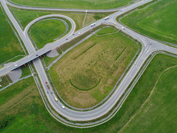 High angle view of highway amidst field