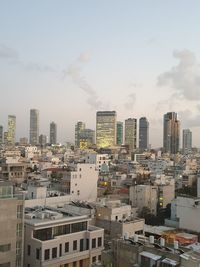 High angle view of buildings in city against sky