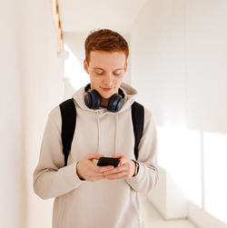 Portrait of young man using digital tablet