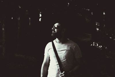 Young woman looking away at night