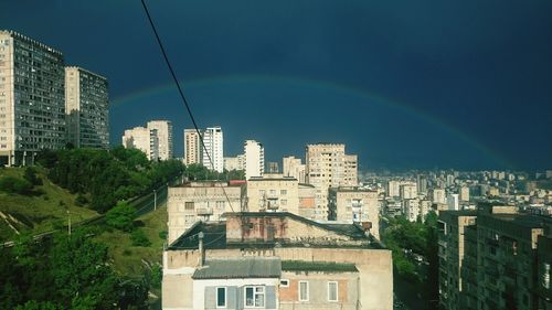 Buildings in city against sky