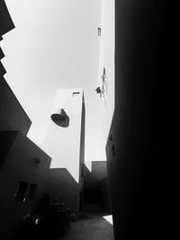 Low angle view of buildings hanging against sky