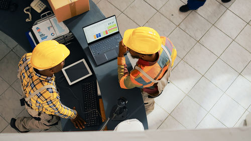 High angle view of man working on table