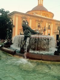 Fountain in front of buildings