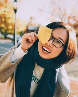 Portrait of smiling young man eating ice cream