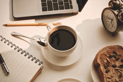 High angle view of coffee cup on table