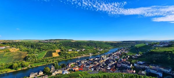 High angle view of landscape against blue sky