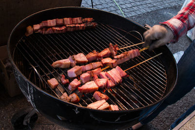 Close-up of cropped hand holding meat