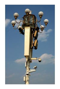 Low angle view of street light against sky