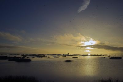 Scenic view of sea against sky at sunset