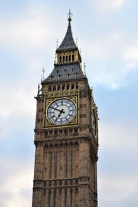 Low angle view of clock tower against sky