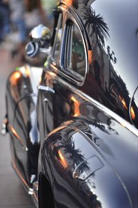 Close-up of vintage car parked on street