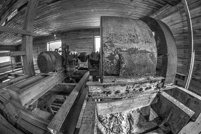 Rear view of people working in abandoned factory