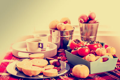 Close-up of apple and fruits on table
