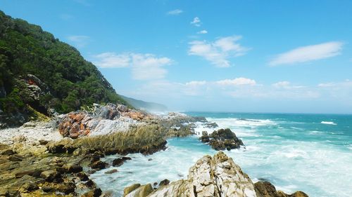 Scenic view of sea against blue sky