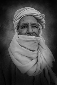 Close-up portrait of senior man wearing headscarf