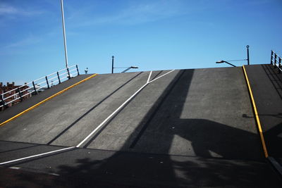 Shadow of woman on road