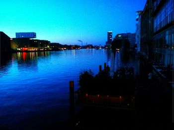 Reflection of illuminated buildings in water