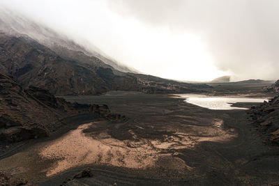 Scenic view of landscape and mountains against sky