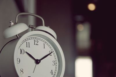 Close-up of alarm clock in living room 