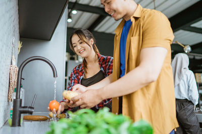 Midsection of man preparing food