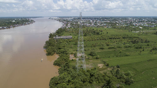 High angle view of trees and sea against sky