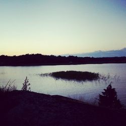 Scenic view of calm lake at sunset