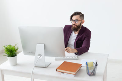 Young man using laptop on table