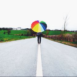 Full length of people walking on field