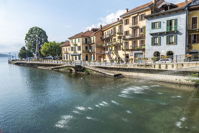  the beautiful omegna, with splendid buildings that are reflected on lake orta