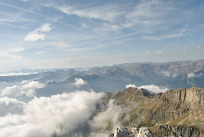 Scenic view of rocky mountains against sky on sunny day